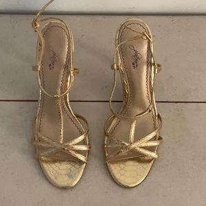 Gold strappy heals.